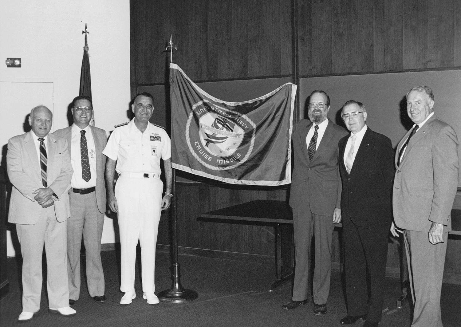 From left: Alvin Schulz, APL associate director; Marion Oliver, Tomahawk program manager; Rear Adm. S. J. Hostettler; Carl Bostrom, Lab director; Al Eaton, assistant director and supervisor of the Fleet Systems Department; and Tom Sheppard, associate supervisor of Fleet Systems.