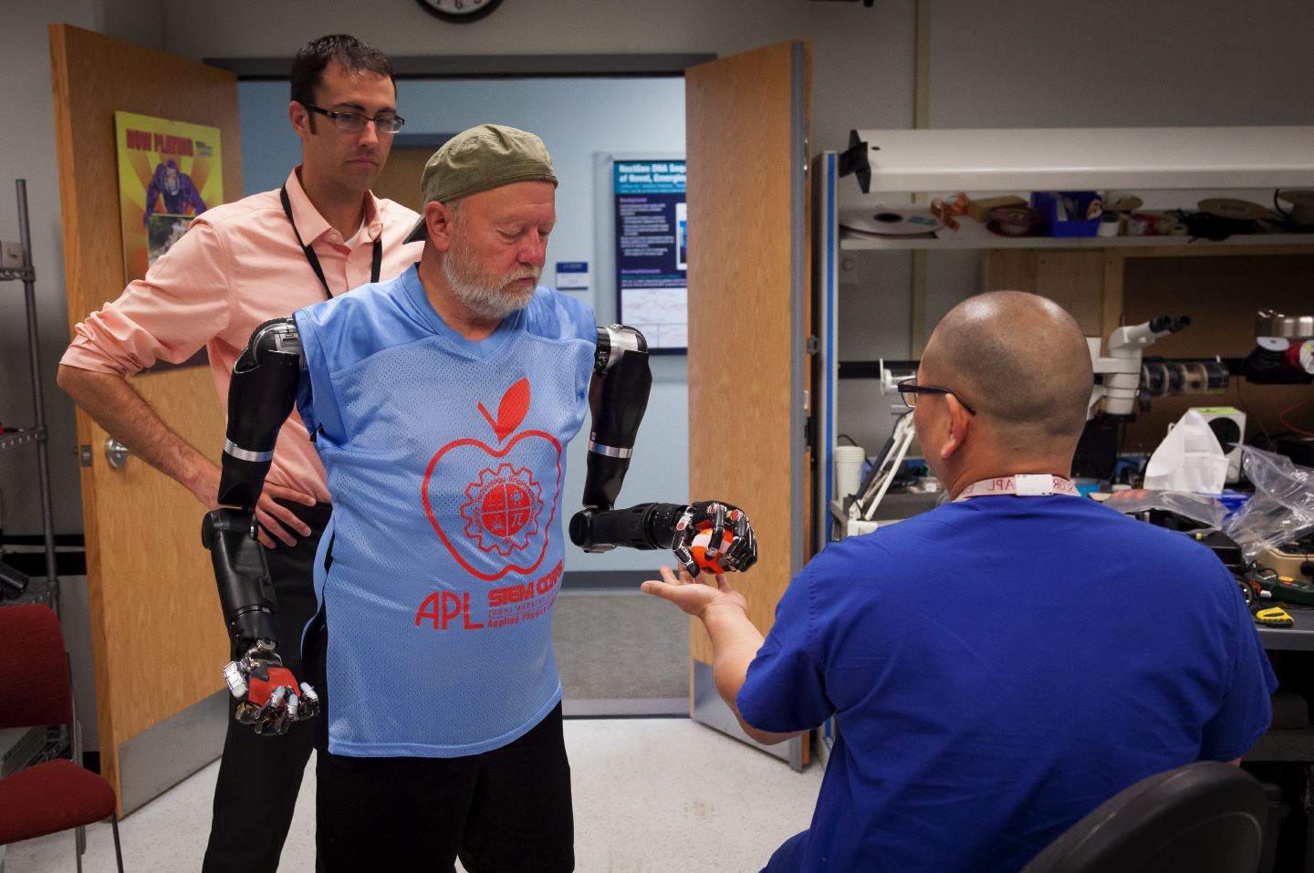 Les Baugh, a Colorado man, makes history at the Lab when he becomes the first bilateral shoulder-level amputee to wear and simultaneously control two of the Laboratory’s Modular Prosthetic Limbs.