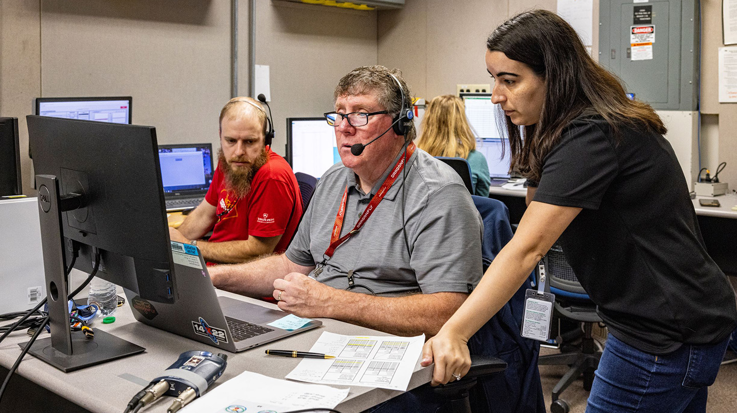 Anthony Drewicz, Brian McGrath and Bernadine Juliano review data from the Dragonfly wind tunnel testing.