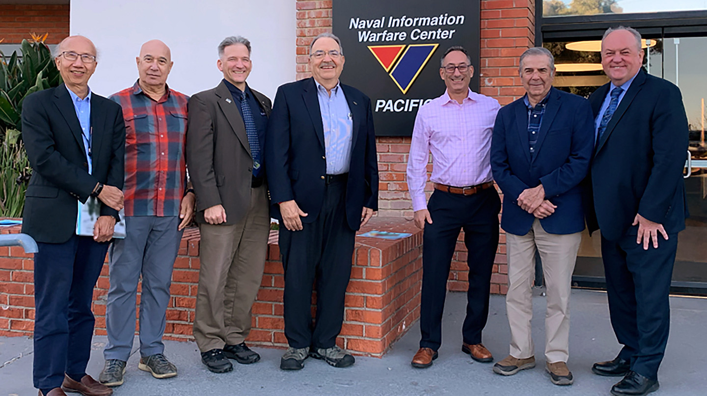 Andy Newman (third from right) stands with past recipients of the Joe Mignogna Data Fusion Award. From left: Chee​-Yee Chong, Alan Steinberg, Erik Blasch, Frank White, Jim Llinas and Mark Owen.