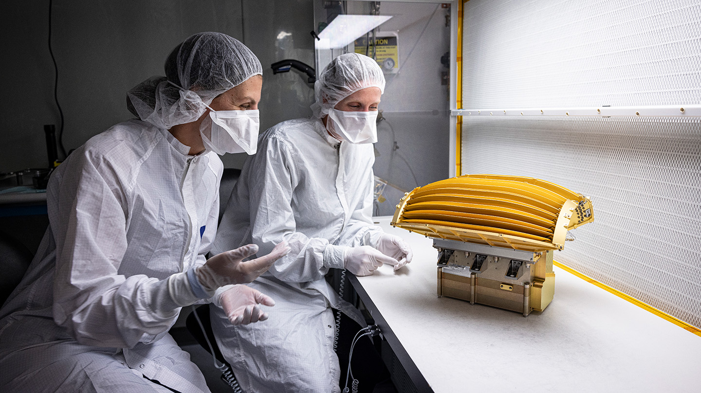 Matina Gkioulidou, IMAP-Ultra instrument lead, left, and Alexandra Dupont, Ultra lead engineer, work on the Ultra instrument at Johns Hopkins APL.