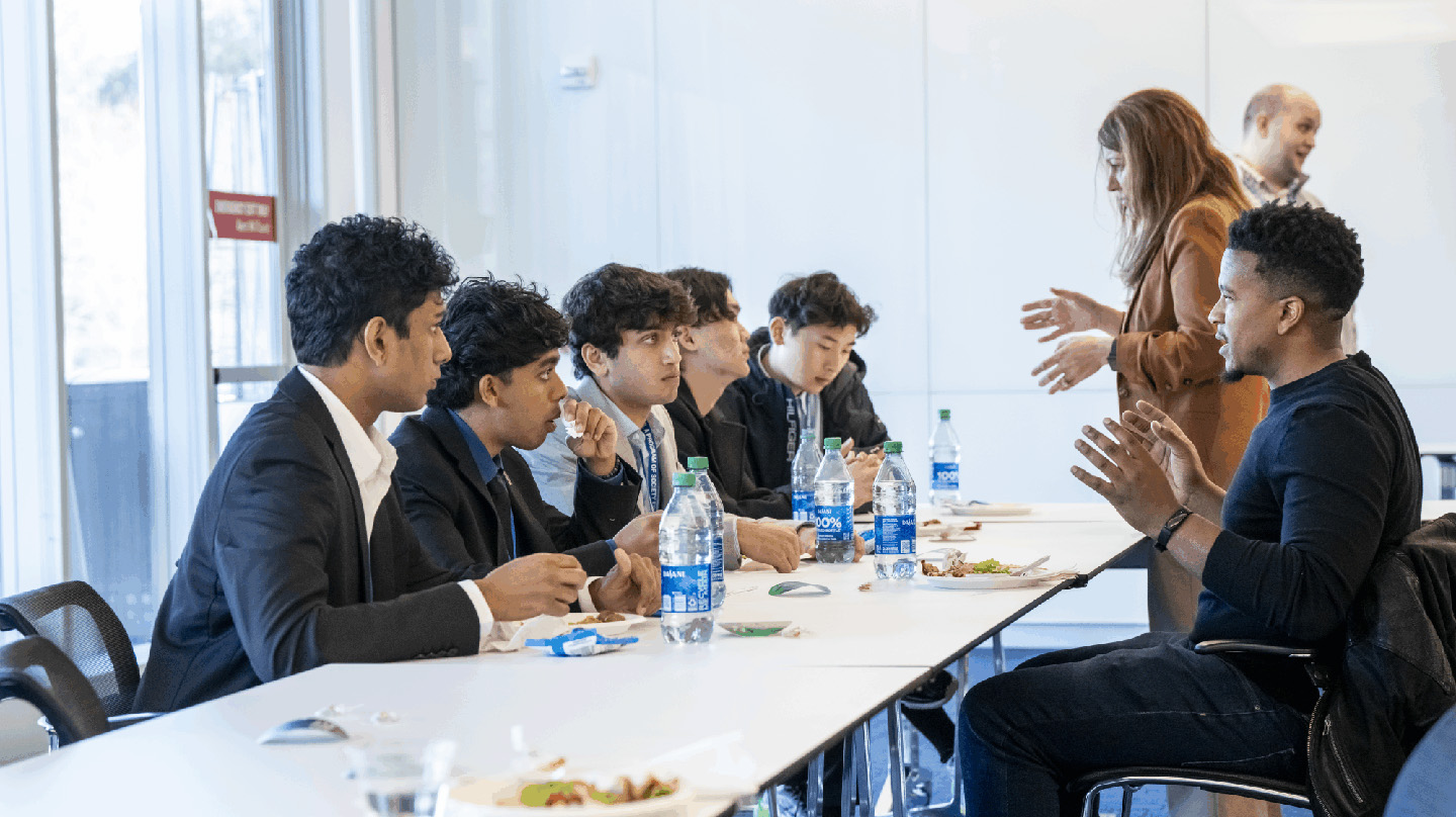 Julian Alford talks with students