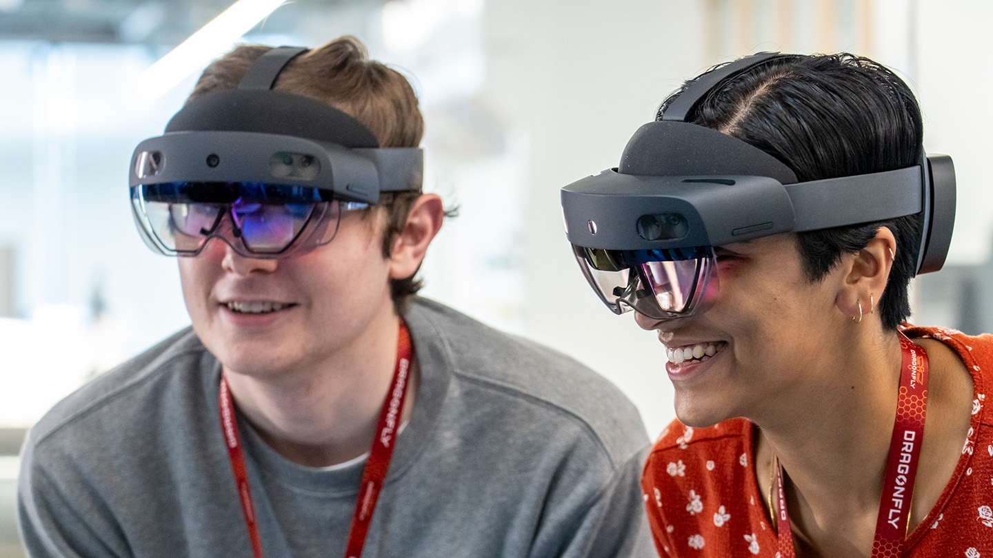 Two engineers use VR headsets