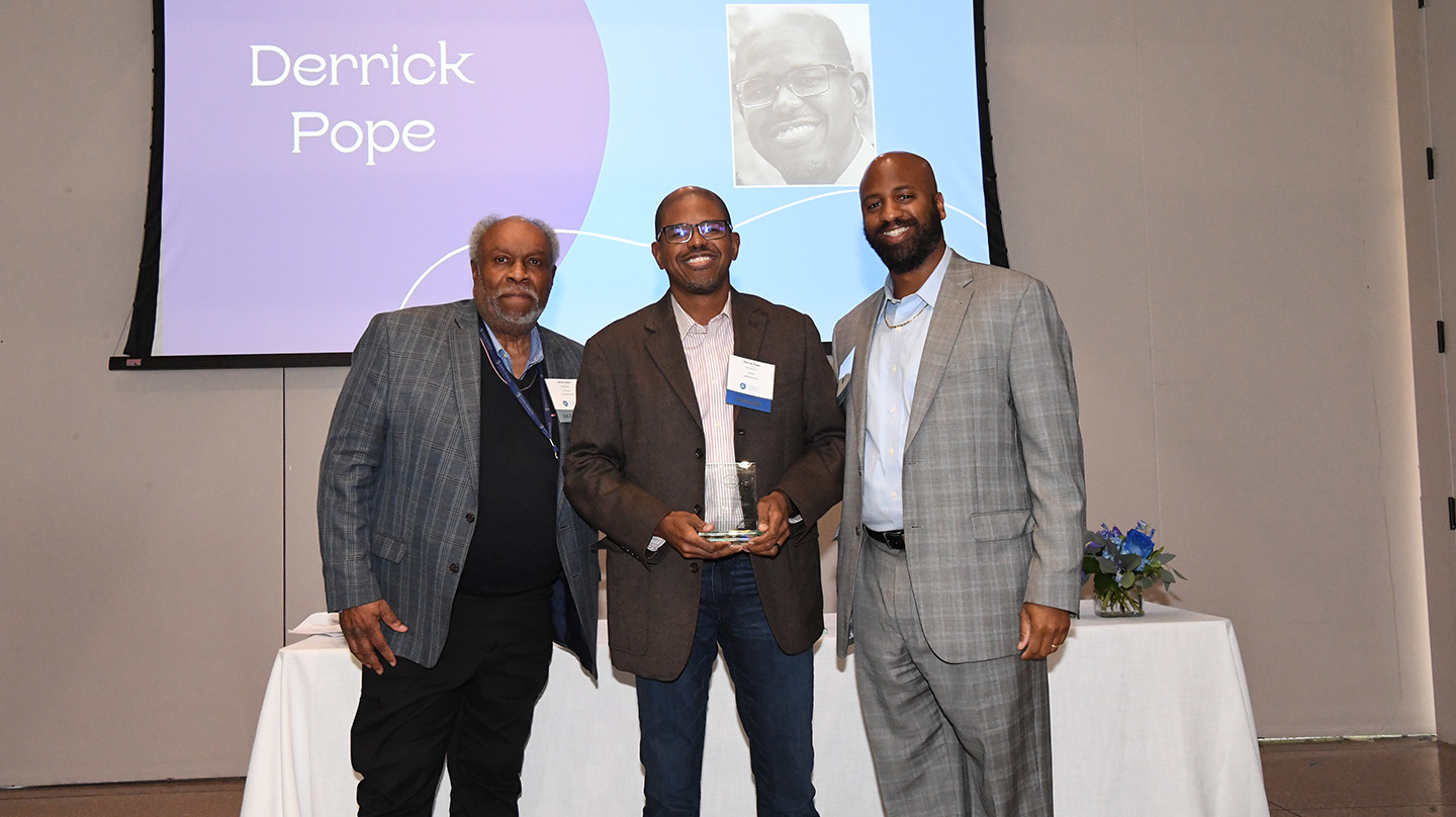 Derrick Pope (center)