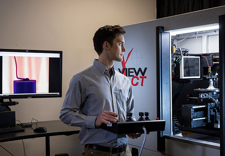 Brendan Croom, a senior materials scientist at Johns Hopkins Applied Physics Laboratory, is pictured in APL’s X-ray Computed Tomography Laboratory, where high-resolution imaging helps researchers analyze additively manufactured materials.