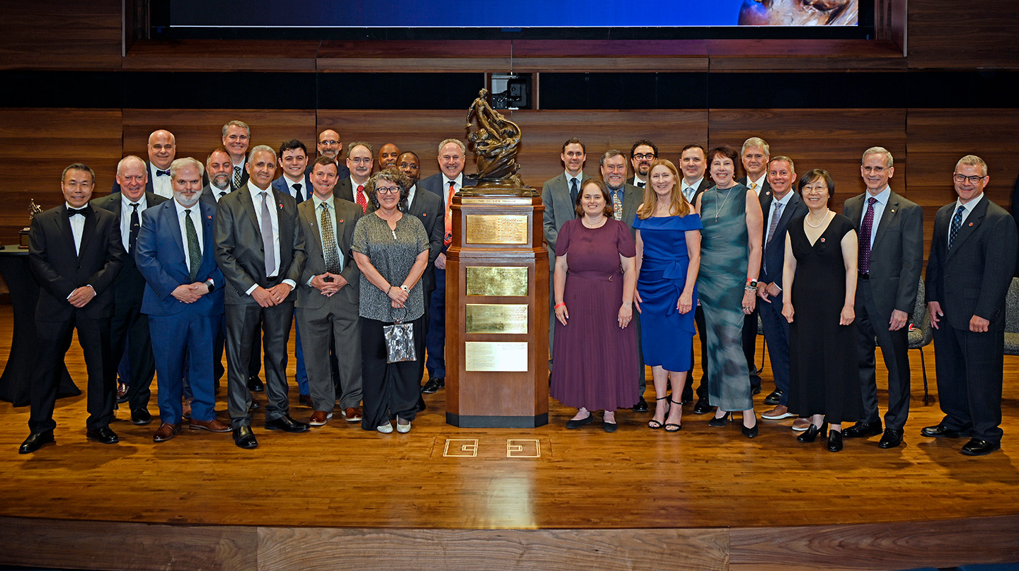 Members of the Parker Solar Probe mission team from NASA, Johns Hopkins APL and partner institutions surround the Robert J. Collier Trophy