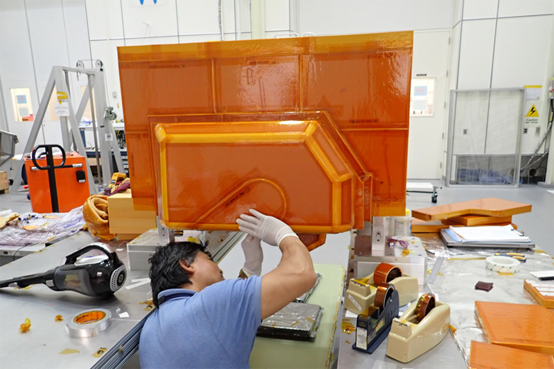Mozany Sosmath prepares a segment of Dragonfly’s foam insulation for testing in the Titan Chamber at the Johns Hopkins Applied Physics Lab.