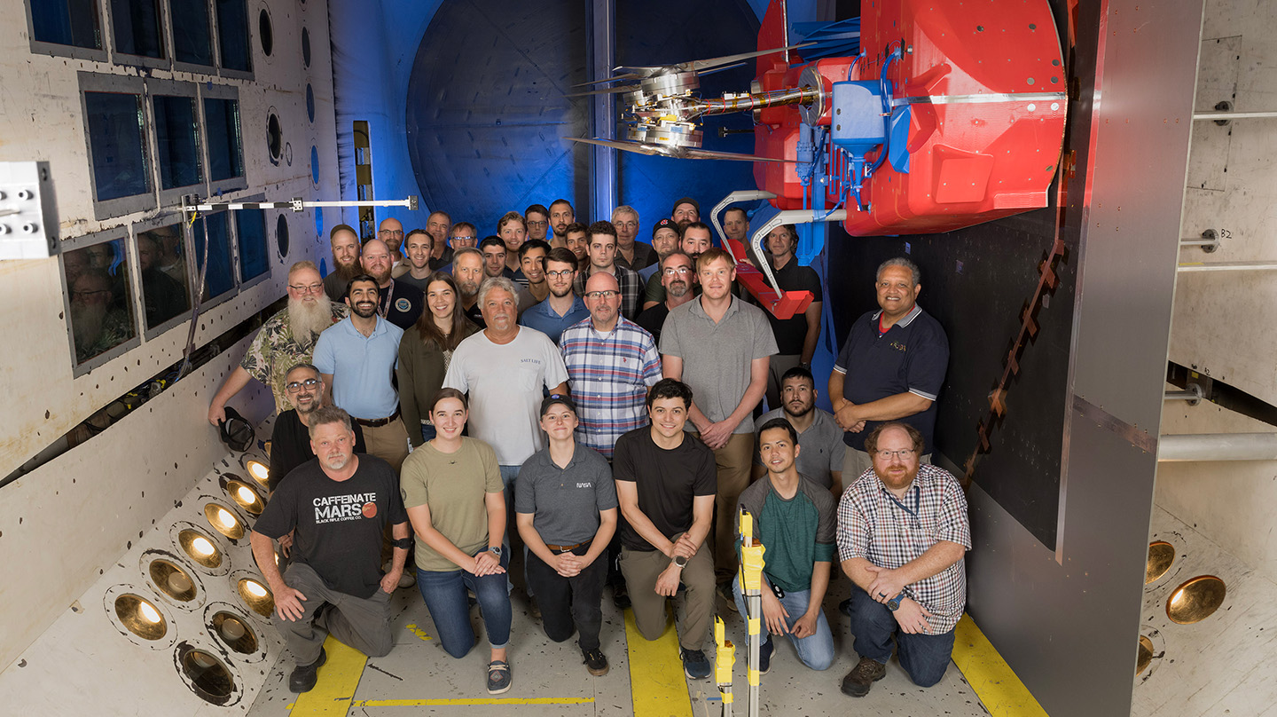 After setting up the full-scale, half-width Dragonfly model, team members from APL, NASA and partner institutions prepare to start tests in the NASA Langley Transonic Dynamics Tunnel facility.
