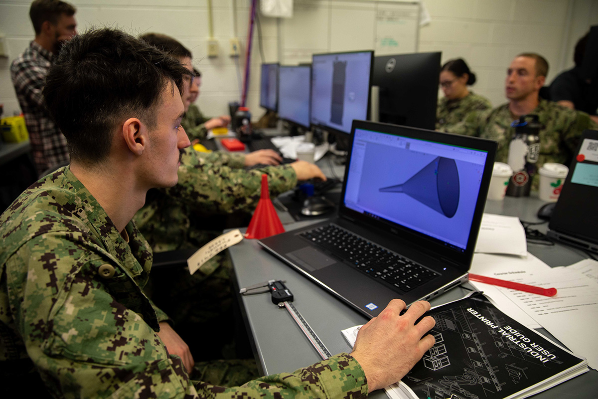  The USS Bataan sent five engineering department sailors to a three-dimensional printing course where they were taught to design and manufacture objects utilizing newly installed additive manufacturing equipment onboard the USS Bataan. (U.S. Navy photo by Mass Communication Specialist 2nd Class Matthew F. Brown)