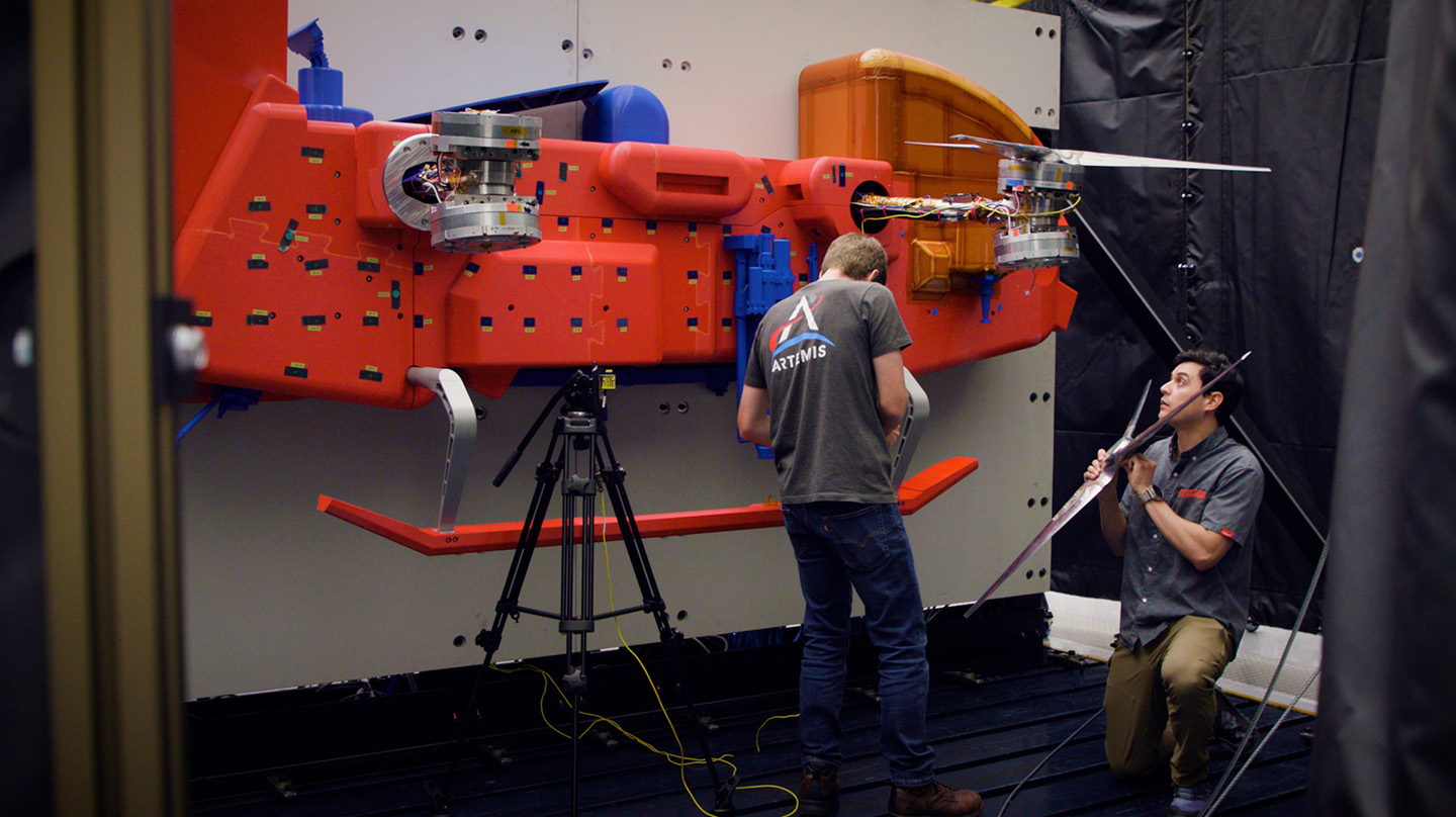 Johns Hopkins APL engineers Tyler Radomsky and Felipe Ruiz install a rotor on the Dragonfly test model at the Transonic Dynamics Tunnel at NASA’s Langley Research Center