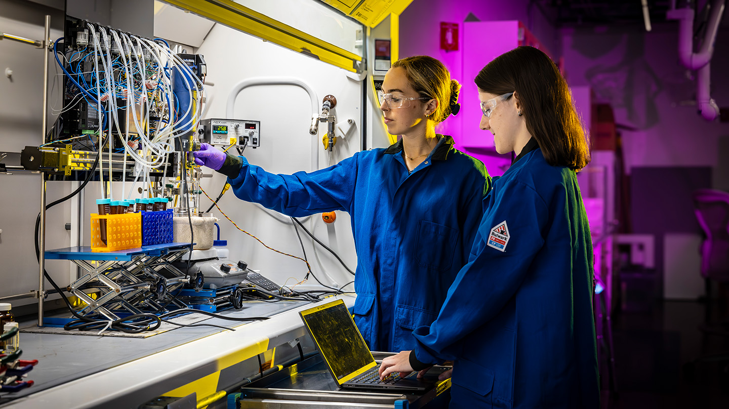 Allison Moyer (left) and Jenelle Millison (right) demonstrate how to use the ATLAS system (Credit: Johns Hopkins APL/Ed Whitman)