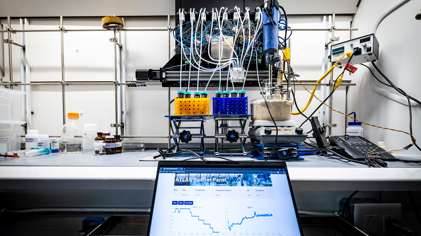 The ATLAS control panel (bottom) allows for real-time remote monitoring of the ATLAS lab system (top)