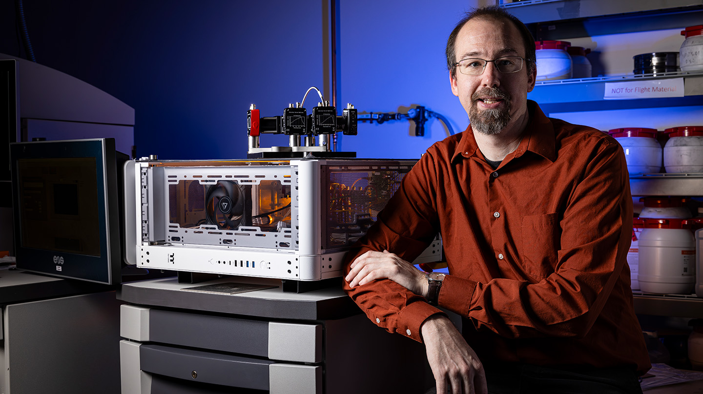 Steve Storck with the Spectrally Augmented Thermal Understanding Reducing Nonconformance (SATURN) sensor and Process Optimized Laser Adjustments Regulated by Integral Sensors (POLARIS) control system