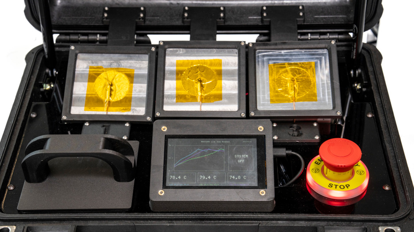 Smart Phase-change Enhanced Re-entry (SPEAR) heatsinks, shown in a retrofitted Pelican case alongside traditional metallic heatsinks, help manage heat in size- and weight-constrained systems.