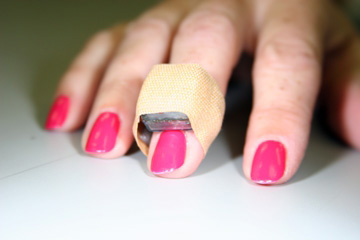 The Ambulatory Raynaud's Monitor wraps around a patient's finger and is secured with a bandage or medical tape
