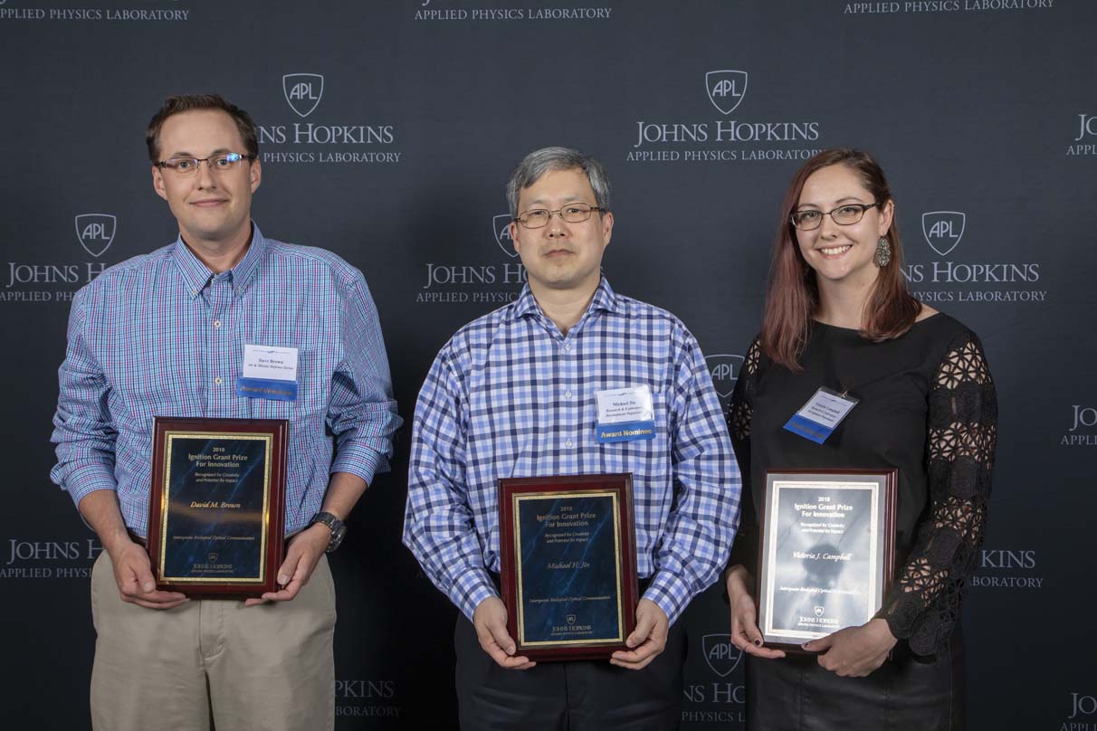 From left to right are David M. Brown, Michael H. Jin and Victoria J. Campbell.