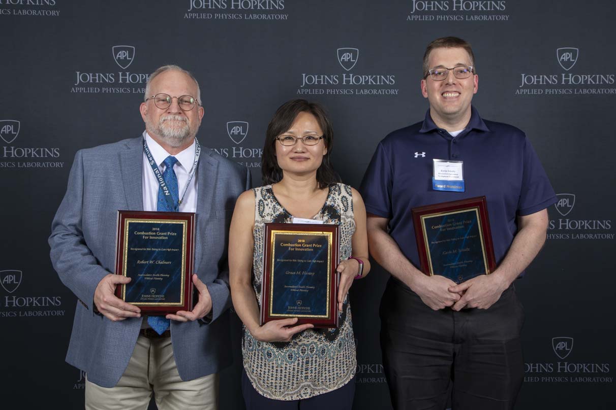 From left to right are Robert W. Chalmers, Grace M. Hwang and Kevin M. Schultz