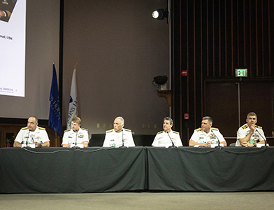 Vice Adm. (Ret.) Mike Connor moderated a panel discussion featuring, from left, Vice Adm. Chas Richard, Vice Adm. Johnny Wolfe Jr., Rear Adm. John Tammen Jr., Rear Adm. Blake Converse, Rear Adm. Scott Pappano and Capt. Pete Small.