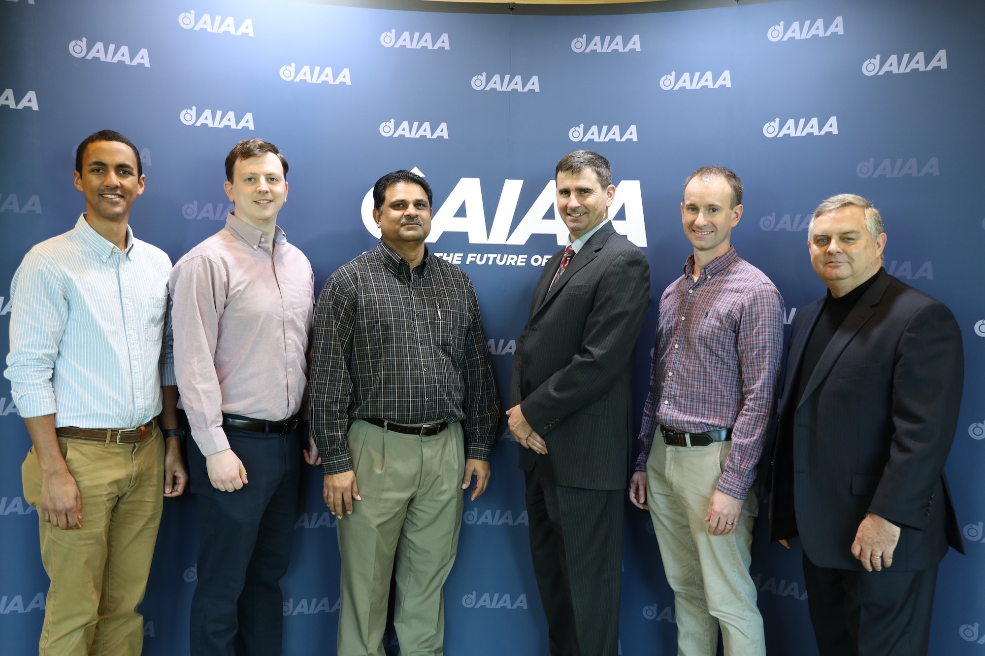 From left, Boundary Layer Transition (BOLT) project team members Daniel Araya, Dennis Berridge, Ashish Nedungadi, Matt Zuber and Brad Wheaton meet with Dave Van Wie before their presentation at the AIAA SciTech Forum.