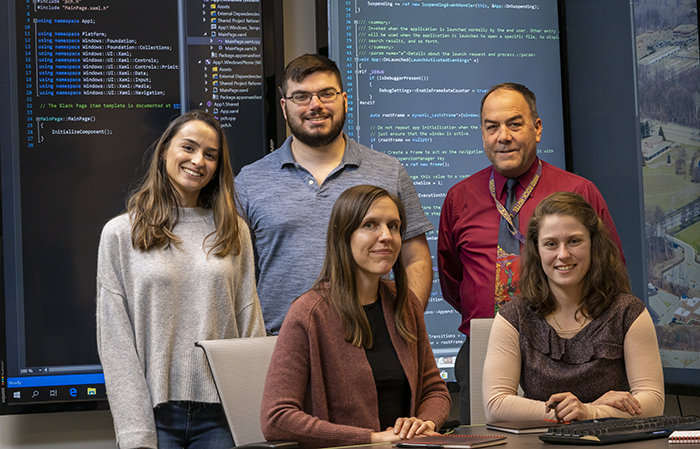 From left, Howard Community College alums turned APL employees Alex Gonzalez, Jake Hoffman and Vanessa Rodgers, with their APL supervisors and mentors Tom Spriesterbach and Jessica Hatch.