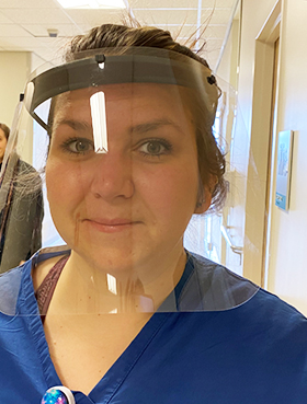 Kristen Wilson, a radiology technologist at The Johns Hopkins Hospital, pictured wearing one of the final iterations of the face-shield prototypes.