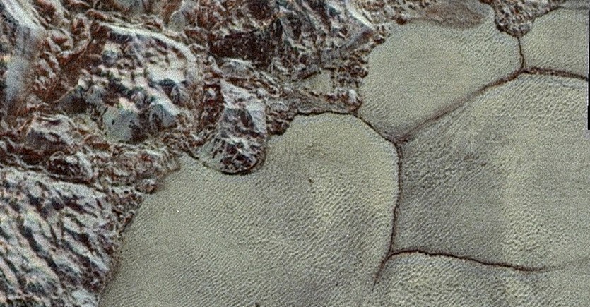 Water-ice mountains on Pluto's Sputnik glacier