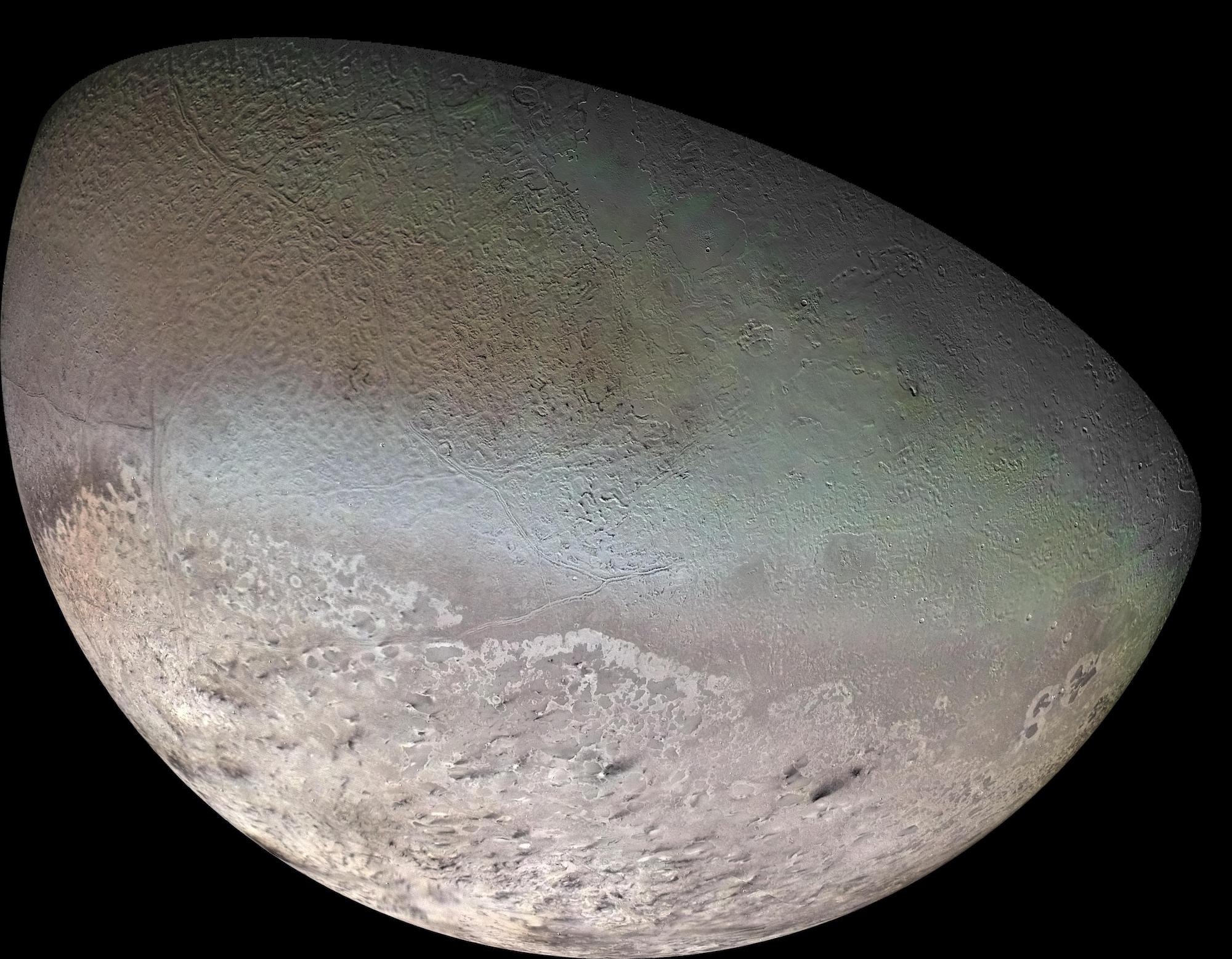 Global color mosaic of Neptune’s moon Triton, taken in 1989 by Voyager 2 as it flew by the Neptune system. Triton may have a liquid water ocean beneath its surface and has active plumes that appear as dark black streaks near the bottom of this image.  Credit: NASA/JPL/U.S. Geological Survey