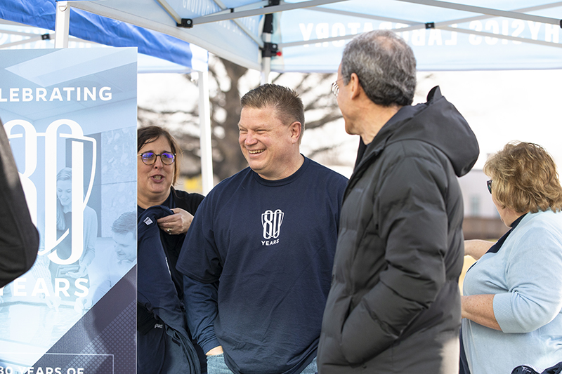 Johnson celebrates APL’s 80th anniversary on the Central Green with Director Ralph Semmel.