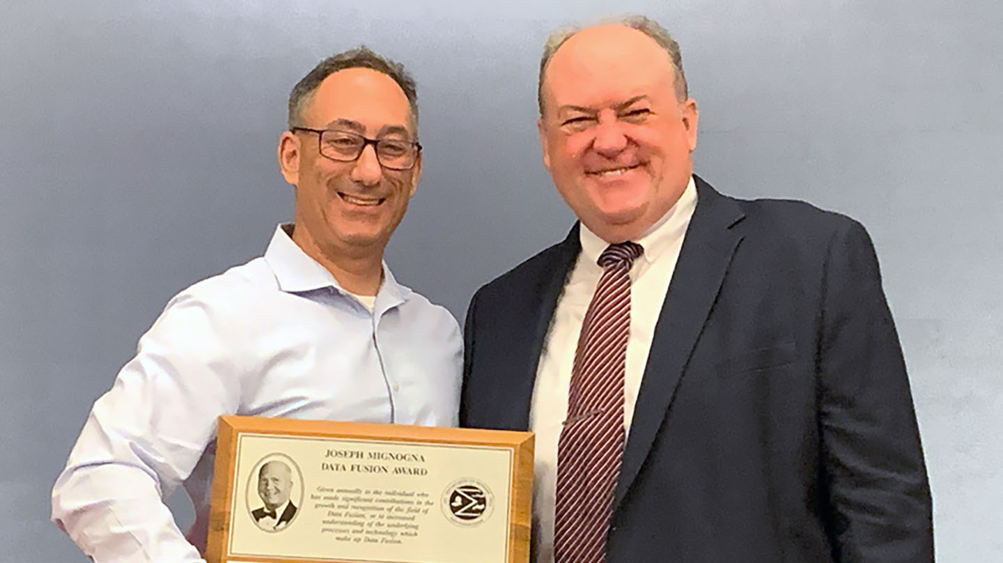 Newman (left) and MSS NSSDF Chair Mark Owen following the Joe Mignogna Data Fusion Award ceremony.