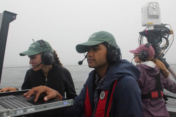 APL FSO operators check the monitors on Sea Hunter as a third operator monitors operations.