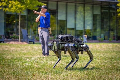 An APL researcher directs a robot to locate an "injured" dummy as part of a demonstration (Credit: Johns Hopkins APL/Ed Whitman)